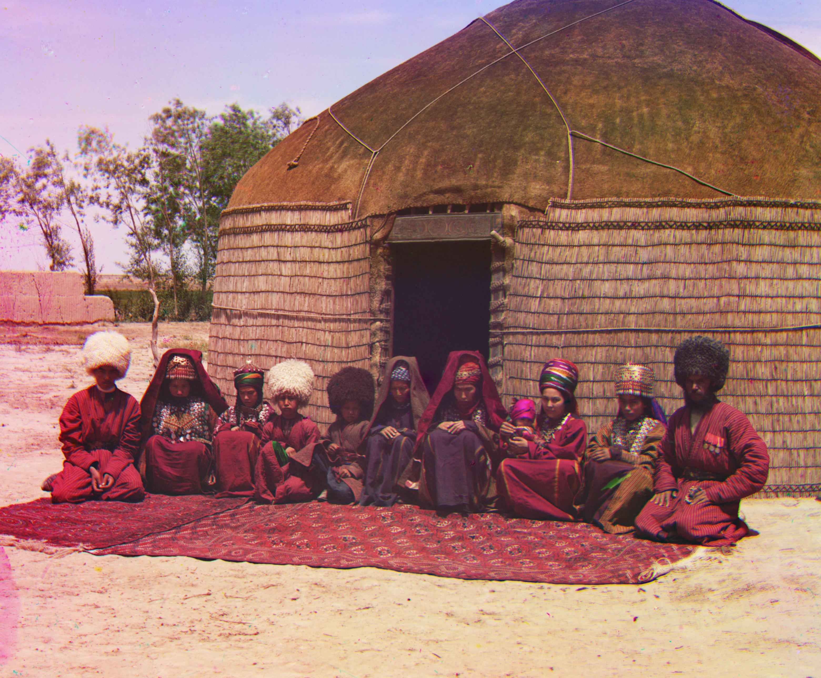 people sitting in front of hut